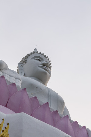 White statue of Buddha at Ubolratana Damの写真素材