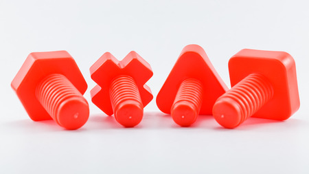 colorful plastic toy,  bolts and nuts on a white backgroundの写真素材