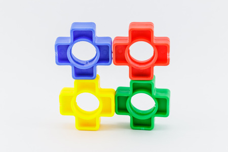 colorful plastic toy,  bolts and nuts on a white backgroundの写真素材