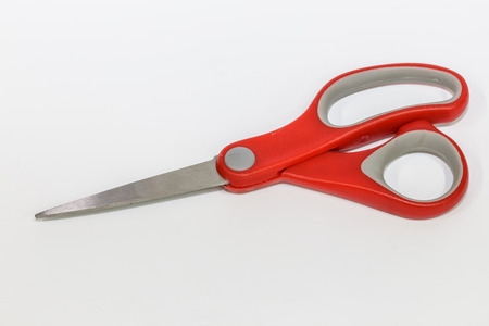 Red scissors isolated on a white backgroundの写真素材