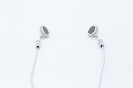 White earbuds isolated on white background