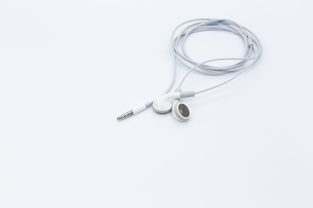 White earbuds isolated on white backgroundの写真素材