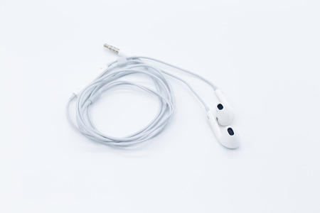 White earbuds isolated on white background