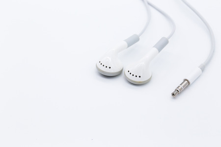 White earbuds isolated on white backgroundの写真素材