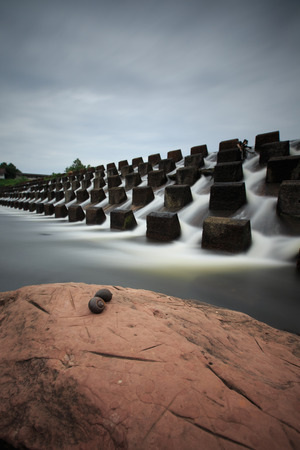 Water pouring down through floodgate at Num Phong KhonKaenの写真素材