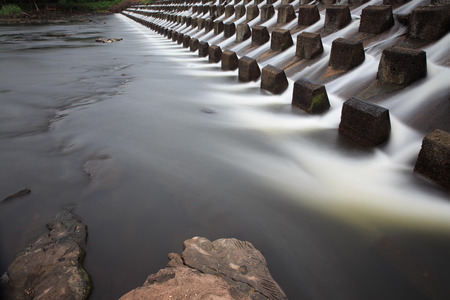 Water pouring down through floodgate at Num Phong KhonKaenの写真素材