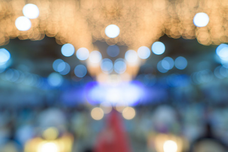 Beautiful blur wedding party under purple lights, bokeh background