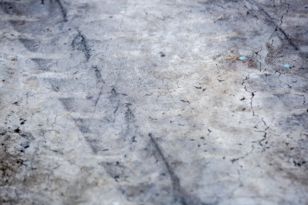 Background with tire marks on road trackの写真素材