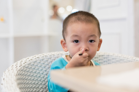 Cute young boy eating ice creamの写真素材