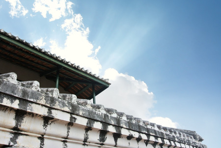 white old wall of asian temple on hill with afternoon  blue  skyのeditorial素材