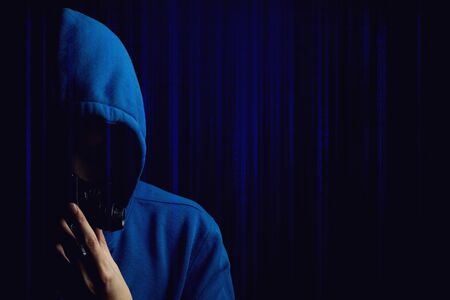 hacker man terrorist with virus computer attack to server network system online in data internet security hacking conceptの写真素材