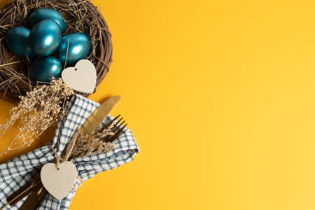 colorful vintage blue easter eggs festival seasoning with yellow background and dinner food object...