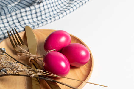 holiday with wood dish dinner pink happy easter eggs on top view white background