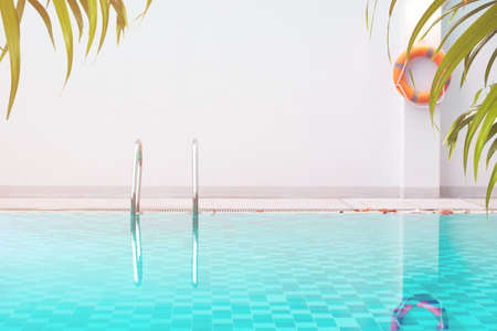 swimming pool of hotel with orange life ring, blue aqua water sea, coconute tree palm leaf nature, summer season holiday vacation, backgroundの写真素材