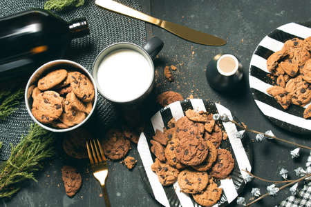 hot sweet dessert cookies biscuit bakery with chocolate and milk in cup mug, kitchen with cooking, vintage table, food and drink, top view flat layの写真素材