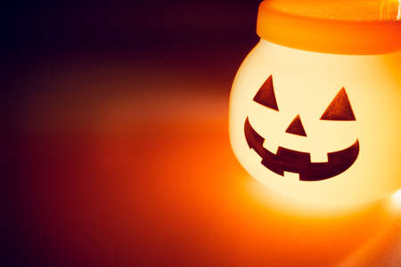 horror spooky funny ghost in halloween pumpkin on holiday season greeting night celebration party with toy prop decoration and trick or treat autumn october festival and jack-o-lantern conceptの写真素材