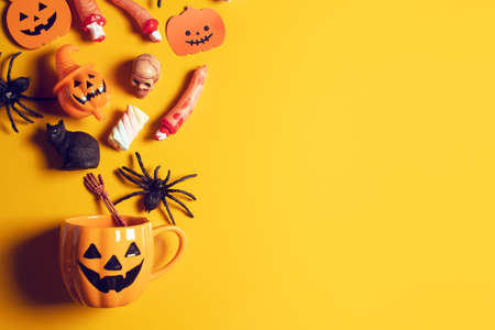 horror spooky funny ghost in halloween pumpkin on holiday season greeting night celebration party with toy prop decoration and trick or treat autumn october festival and jack-o-lantern conceptの写真素材