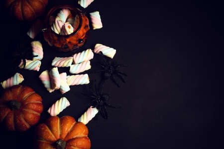 horror spooky funny ghost in halloween pumpkin holiday season greeting night celebration party with toy prop decoration in top view flatlay and trick or treat festival conceptの写真素材