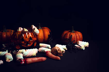horror spooky funny ghost in halloween pumpkin holiday season greeting night celebration party with toy prop decoration in top view flatlay and trick or treat festival conceptの写真素材