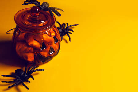 horror spooky funny ghost in halloween pumpkin holiday season greeting night celebration party with toy prop decoration in top view flatlay and trick or treat festival conceptの写真素材