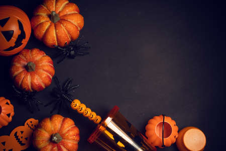 horror spooky funny ghost in halloween pumpkin holiday season greeting night celebration party with toy prop decoration in top view flatlay and trick of treat festival conceptの写真素材
