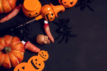 horror spooky funny ghost in halloween pumpkin holiday season greeting night celebration party with toy prop decoration in top view flatlay and trick of treat festival conceptの写真素材