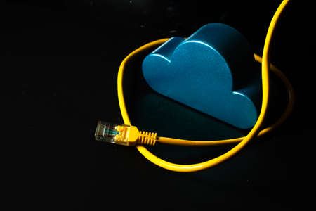 blud cloud storage toy model with internet server online yellow lan wire on black background in...