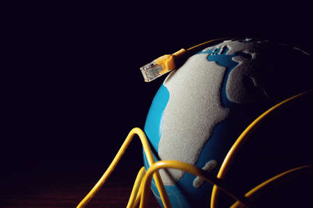 business and technology concept, blue global earth with digital internet network server online lan wire with securityの写真素材