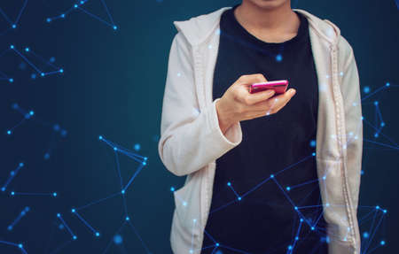 teen girl with social online smartphone network with blue wall background, data deep learning,...