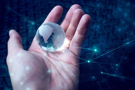business hand hold global glass world with online networkの写真素材
