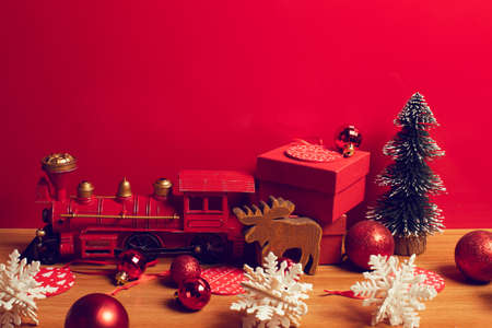 train toy gift gloss glitter decoration ball hanging with snowflake for merry christmas tree in holiday season greeting of happiness concept background, wish for god blessの写真素材