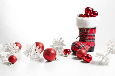 big snow shoe boots and glitter gloss ball for merry christmas season greeting conceptの写真素材