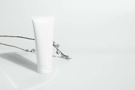 fresh beauty spa medical skincare and cosmetic lotion cream facial tube bottle packaging product on white decor background with summer season sun lightの写真素材