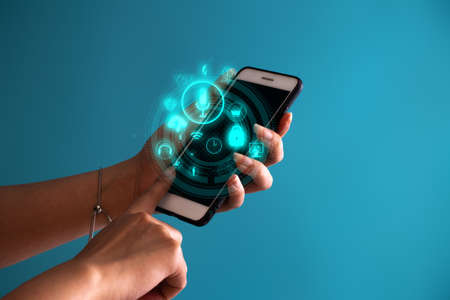 business girl hand holding the device technology smartphone for digital telecom contact to social network internet conceptの写真素材