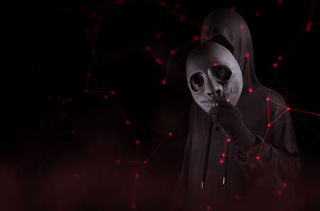 hacker man wear mask terrorist with virus computer attack to server network system online in data...