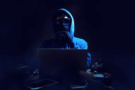 hacker man terrorist with virus computer attack to server network system online in data internet...