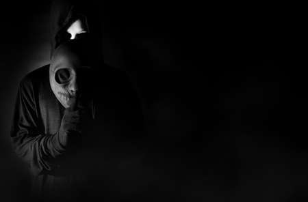 hacker man wear mask terrorist with virus computer attack to server network system online in data internet security hacking ai conceptの写真素材