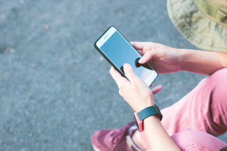 woman using smartphone network for gps map searching location on adventure travel trip on nature landscape cliff, backpack go to moutainの写真素材