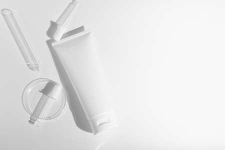 beauty spa medical skincare and cosmetic lotion bottle cream spray packaging product on white decor background with science laboratory glass testの写真素材