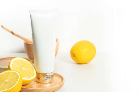 beauty spa medical skincare and cosmetic lotion bottle cream packaging product on white decor background with lemon food fruit vitamin c herb extractの写真素材