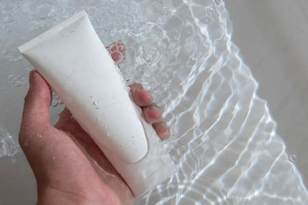 beauty treatment medical skincare and cosmetic lotion cream serum oil mockup bottle packaging product on water splash background, healthcare and medicine conceptの写真素材