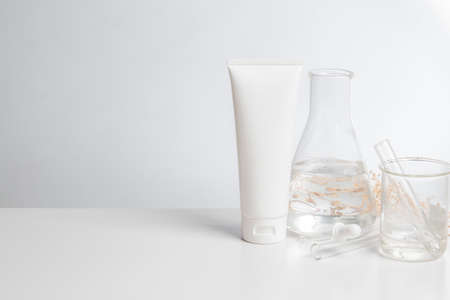 close up science medical chemical and treatment cream lotion aromatic beauty cosmetic skincare with test tube and mockup product on table white backgroundの写真素材