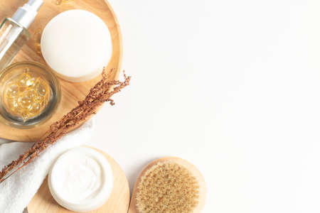 herbal with soap and spray bottle with facial cream with wood dish and bath brush in beauty healthy cosmetic treatment concept in top viewの写真素材