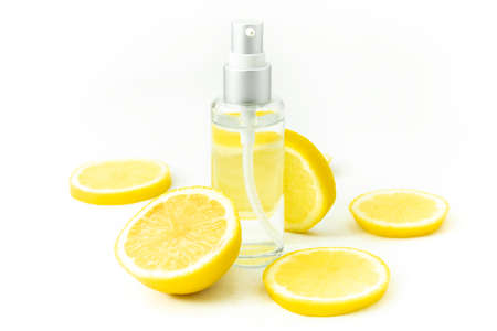 lemon with perfume water extract bottle mockup for nutrition spa or cosmetic healthy conceptの写真素材