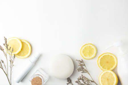 top view water lemon fruit extract with mockup cream cosmetic spray natural beauty soap for facial...