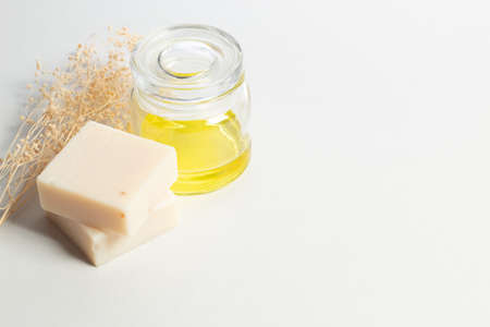 lemon oil extract with soap spa treatment cosmetic and dried leaf flower on white background
