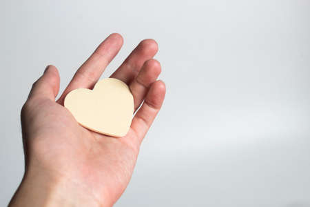 hand and happiness family with love red heart decoration in festive holiday season greeting of valentine's day gift wedding backgroundの写真素材