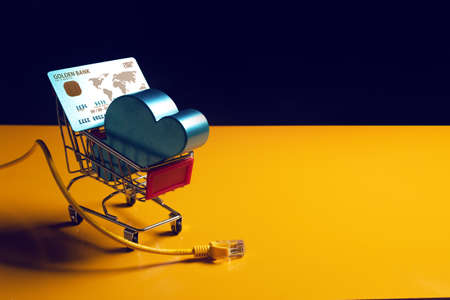 shopping cart online internet electronic payment device with premium credit card of digital banking investment financial and money business concept and cloud storageの写真素材