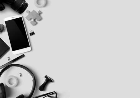 smartphone with office object gadget stationery on table background flat lay in business at home conncept, minimal modern working space, education school toolsの写真素材