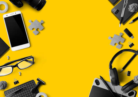 office tool gadget business on yellow table background in business at home connceptの写真素材